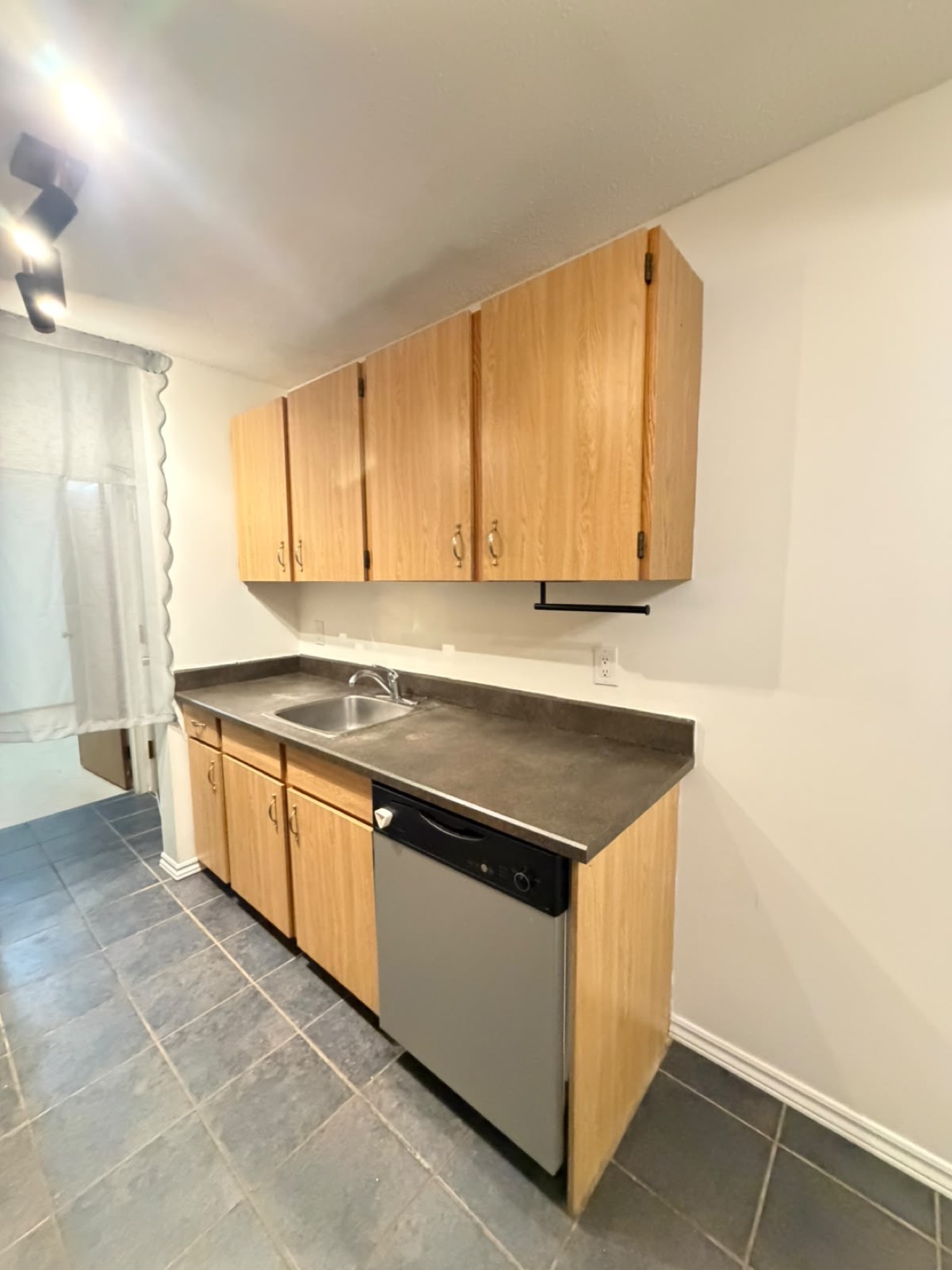 Kitchen sink area after clean